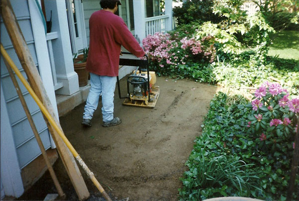 Compacting soil